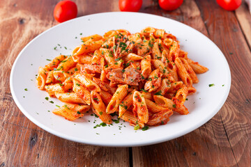 Pasta with tuna in tomato sauce, typical food of Mediterranean Italian cuisine.