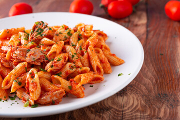Pasta with tuna in tomato sauce, typical food of Mediterranean Italian cuisine.