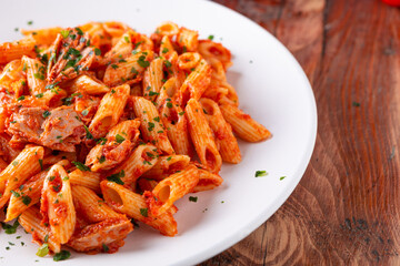 Pasta with tuna in tomato sauce, typical food of Mediterranean Italian cuisine.
