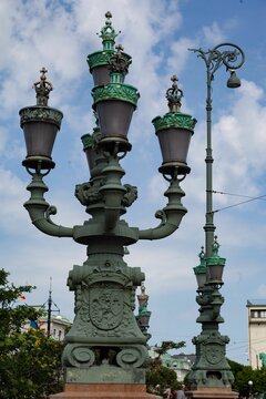 Vertical shot of antique street light in the Brunnsparken park in Gothenburg, Sweden