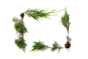 Fototapeta premium Christmas background from green fir branches on isolated white background, frame, top view 