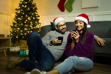 Relaxed couple drinking hot tea during christmas holidays