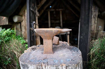 Anvil in front of a medieval blacksmith's hut