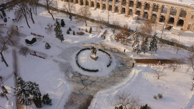 Equestrian statue of hetman Sahaidachny in Kiev Ukraine. Aerial top view square covered with snow.