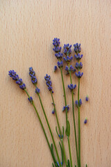 Lavender flowers on a wooden board.