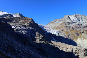 Majestic alpine landscape view of Üssers Barrhorn, Weisshorn and Bishorn covered by Brunegg glaciers in Swiss Alps, Wallis, Switzerland
