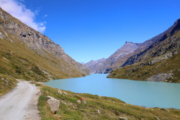 Naklejka na ściany i meble Mauvoisin reservoir located in Val de Bagnes, Valais with concrete arch dam, Switzerland