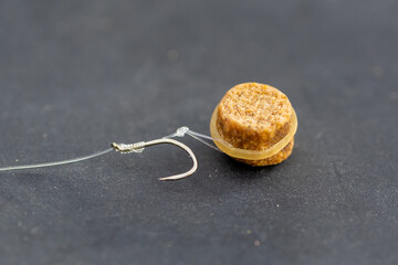 Pellet on a hair with band. Banded pellet. Bait for carp. Barbless hook tied with a knotless knot.