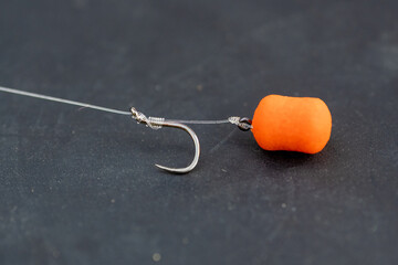 Pellet on a hair spiking bayonet. Bait for carp. Barbless hook tied with a knotless knot.