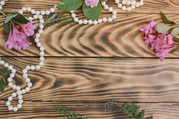 Beautiful bouquet of hydrangeas with gift box on beige background. Greeting card with hearts. Creative background with copy space for text. Flat lay, top view concept.