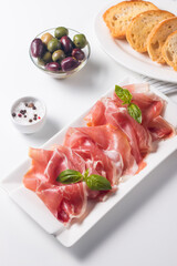 Closeup of thin slices of prosciutto. Italian food 