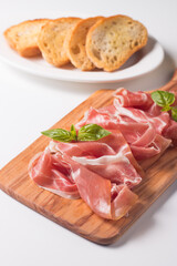 Closeup of thin slices of prosciutto. Italian food 