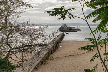 Breakwater at Bikinis Beach and Torre Island. Santander