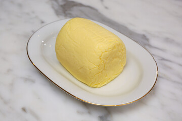 Butter on a white plate