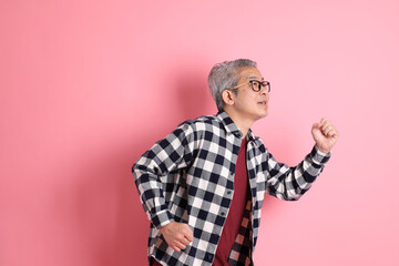 Naklejka premium Asian Man on Pink