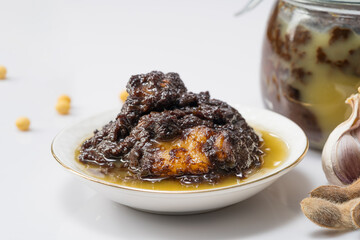 Fresh fried soybean meat sauce on monochrome background