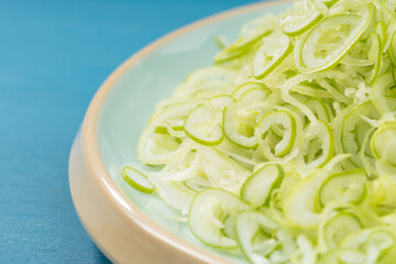 Fresh green onion on blue background