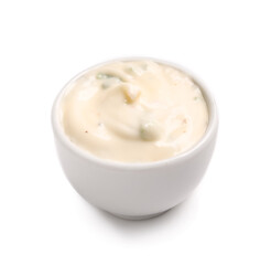Sauce bowl with Caesar salad dressing on white background