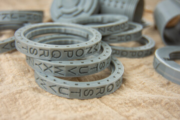 Plastic round letters rings printed on a 3D printer for cryptex printed by FDM technology with gray...