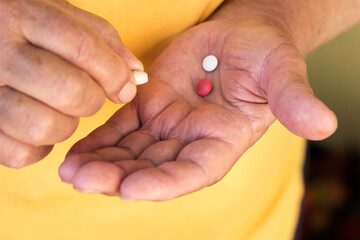 Senior woman taking daily medicine