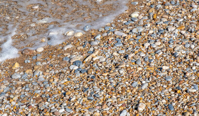 Pebbles on a beach at Kamares on Sifnos island in Greece