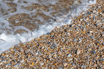 Pebbles on a beach at Kamares on Sifnos island in Greece