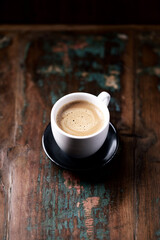 Cup of coffee on rustic wooden background. Close up. Copy space.