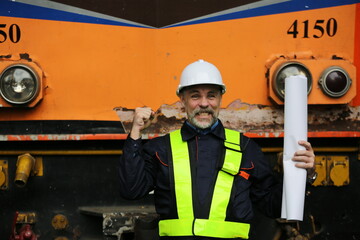 Man engineer standing on construction site or equipment maintenance work site.