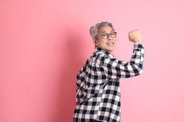 Naklejka premium Asian Man on Pink