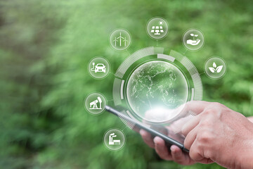 Human hand holding smartphone and green earth ESG icon environmental, social governance in sustainable ethical business network connect on green background. sustainable environmental concept