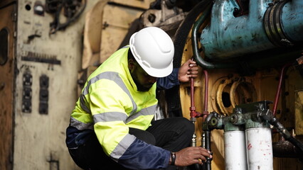 Portrait of maintenance engineer or apprentice in workshop of railway engineering facility