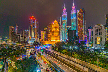 Petronas KLCC Twin Tower building with the color of Petronas GP Motorsports theme - obrazy, fototapety, plakaty