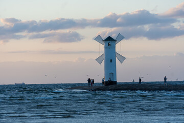 Windmill on the coast at sunset in Świnoujście.
Poland, See, Sommer 2022