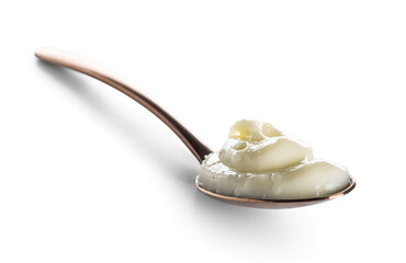Spoon of tasty vanilla pudding on white background