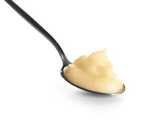 Spoon with tasty vanilla pudding on white background, closeup