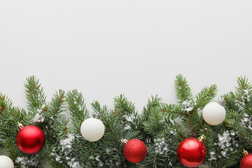 Composition with fir branches and Christmas balls on white background