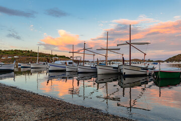 reflection of boats at sunset