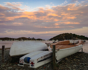 boats at sunset with the moon