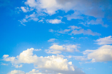 Naklejka na ściany i meble Beautiful clouds with blue sky background. Light sunlight and light clouds for creative graphic design