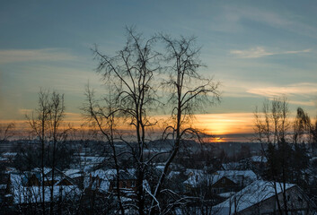 View of snow-covered rooftops on a frosty winter morning