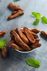Sun dried bananas, healthy vegan vegetarian food snack concept.
