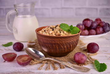 Granola with raisins and milk. Healthy breakfast.
