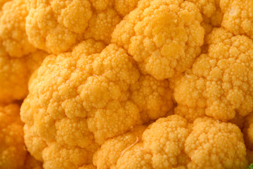 Macro texture of cauliflower yellow. Food background. Colorfu cauliflower. Agricultural harvest. Mock up. Top view.