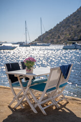 chairs and served table on the fancy beach restaurant