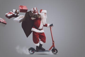 Fast Santa Claus on electric scooter © stokkete