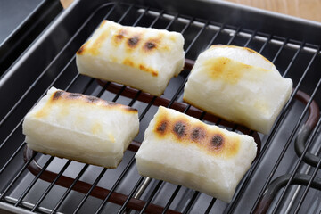 Cooking Yaki Mochi (grilled Japanese rice cake )