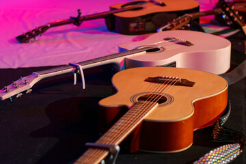 Fototapeta premium Three guitars arranged in a stage setting before the concert