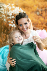 Mother with her daughter at a picnic