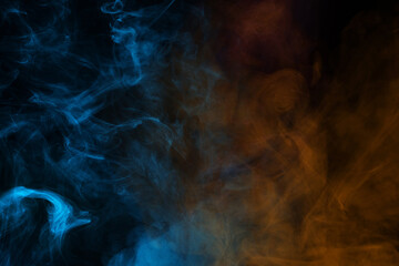 Obraz na płótnie Canvas Blue and pink steam on a black background.