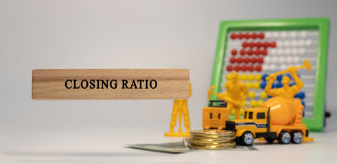 Closing ratio was written on wood. Money and business machines in the background. Economy and...